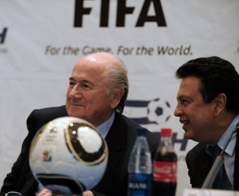 FIFA president Joseph Blatter (L), talks with Alfredo Hawit, Honduras' National Football Federation secretary, before participating in a press conference, in Tegucigalpa on April 12, 2011. Blatter is touring Central America as part of his reelection campaign. AFP PHOTO/Orlando SIERRA. / AFP / ORLANDO SIERRA