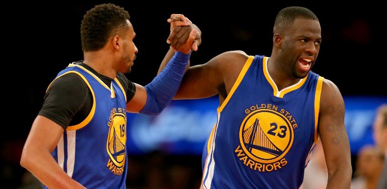 NEW YORK, NY - JANUARY 31: Leandro Barbosa #19 and Draymond Green #23 of the Golden State Warriors celebrate in the second half against the New York Knicks at Madison Square Garden on January 31, 2016 in New York City. NOTE TO USER: User expressly acknowledges and agrees that, by downloading and or using this photograph, User is consenting to the terms and conditions of the Getty Images License Agreement. Elsa/Getty Images/AFP
