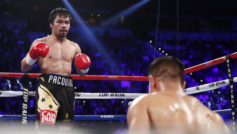 manny-pacquiao-ante-un-jessie-vargas-de-rodillas-en-la-lona-tras-caer-a-la-misma