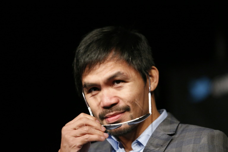El boxeador filipino Manny Pacquiao en una rueda de prensa en Nueva York el 21 de enero de 2016 / AFP / Kena Betancur
